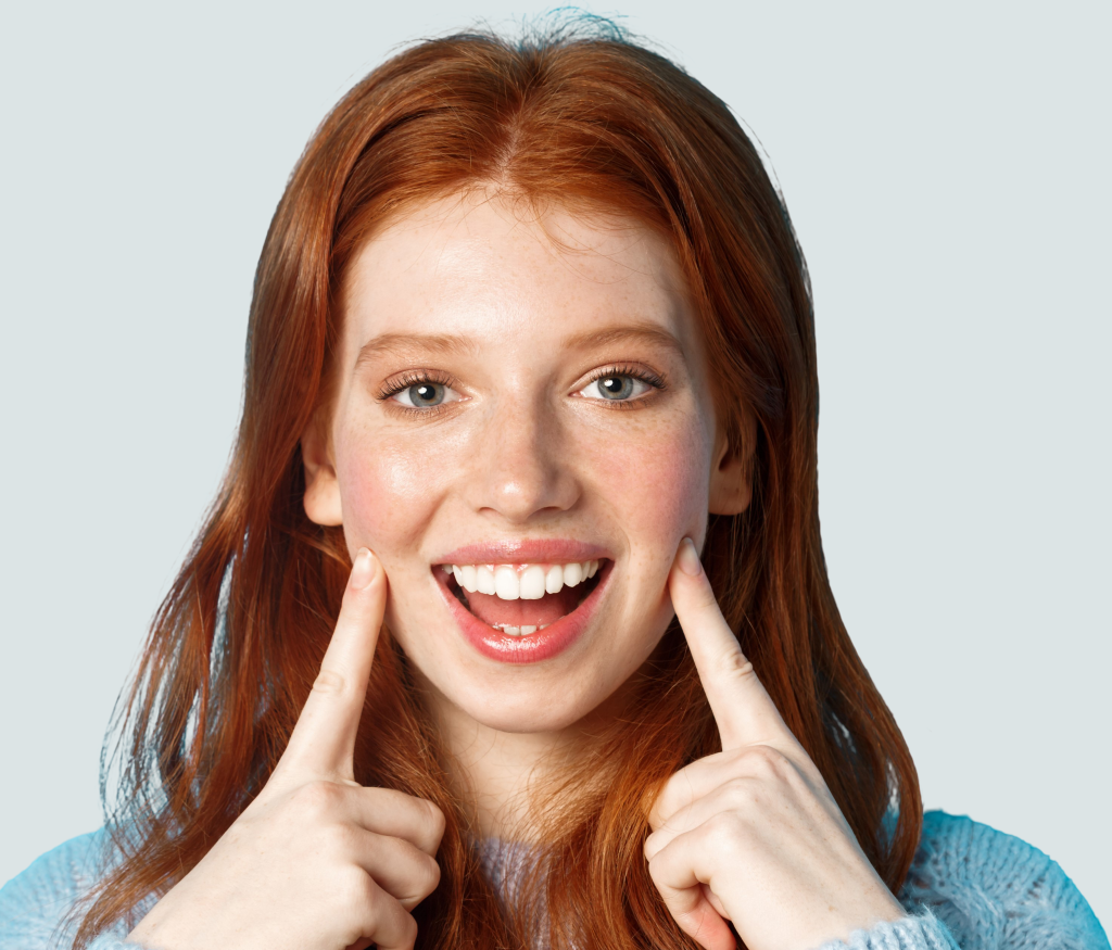 Teeth Whitening at Aroma Dental in Humble, TX: a patient smiling brightly after a professional in office teeth whitening session
